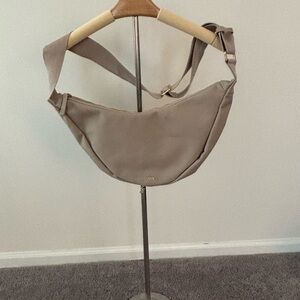 Tan Crossbody Bag with Adjustable Strap and Minimalist Design